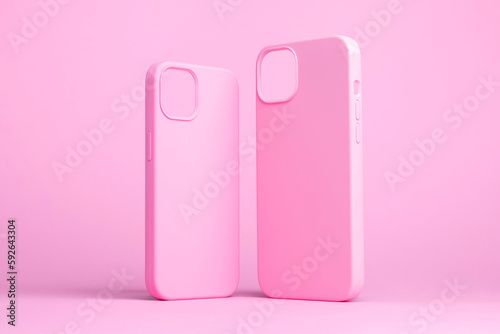 set of two pink cases for iPhone 15 and 14 Plus or iPhone 13 and 13 mini back side view isolated on pink background, monochrome colours phone case mock up