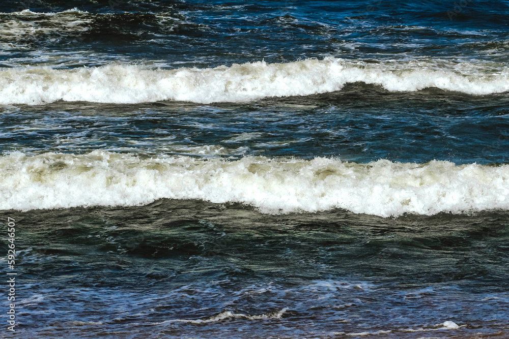 Waves on the Baltic Sea in Klaipeda in spring. The concept of tourism in Europe