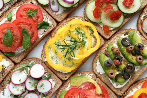 Open face vegetable sandwiches - vegan vegetarian - colorful food flat lay background