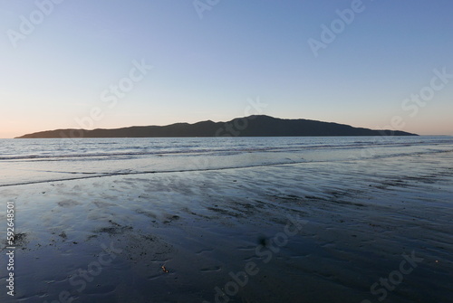 Kapiti Island and beach, Paraparaumu, New Zealand photo