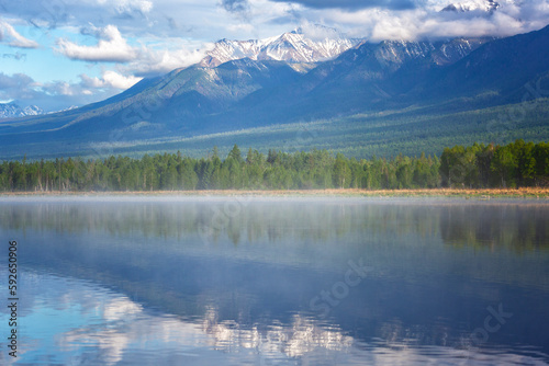 Russia. Landscape with mountains reflecting in the water on summer day. Buryatia, Tunkinskaya valley