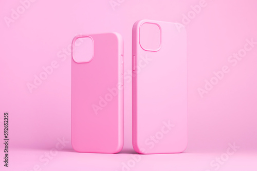 set of two pink cases for iPhone 15 and 14 Plus or iPhone 13 and 13 mini back side view isolated on pink background, monochrome colours phone case mock up © iso100production