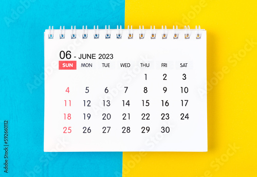 The June 2023 Monthly desk calendar for 2023 year on blue and yellow background.