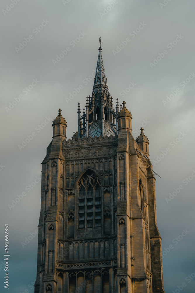 Large church building spire, historic architecture, gothic cathedral structure, tall building in Norwich religious place of worship