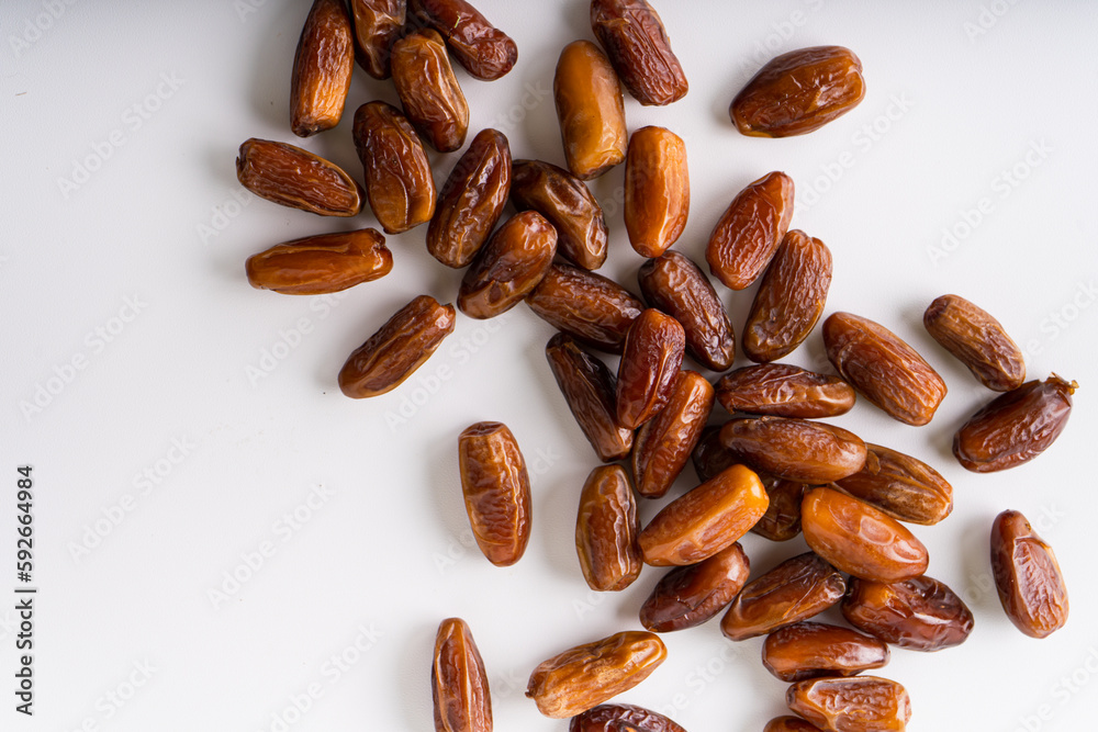 Fresh dried dates fruit on white isolated background. Fresh dried dates fruit on white isolated background.