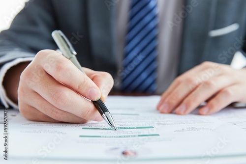 Businessman signing a contract © Natalie Portman/Wirestock Creators