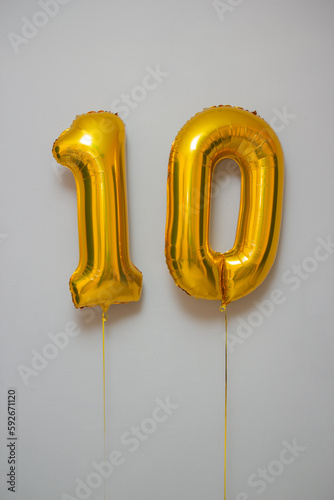 golden balloons number 10 on white background