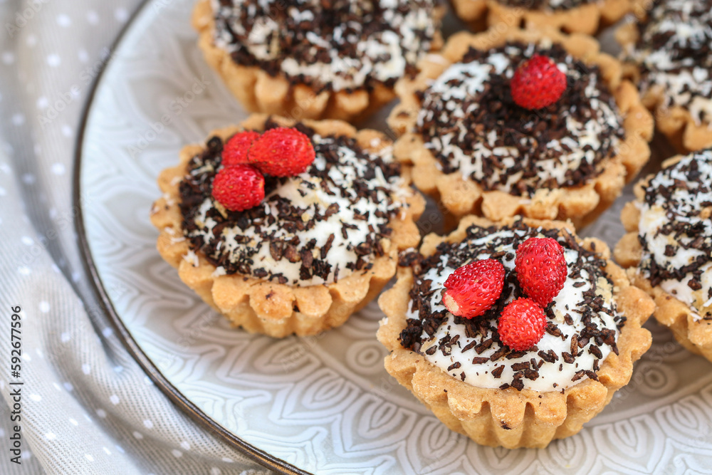 Tiny cupcakes with fruits and chocolate on the table. Tiny cupcakes with fruits and chocolate on the table.