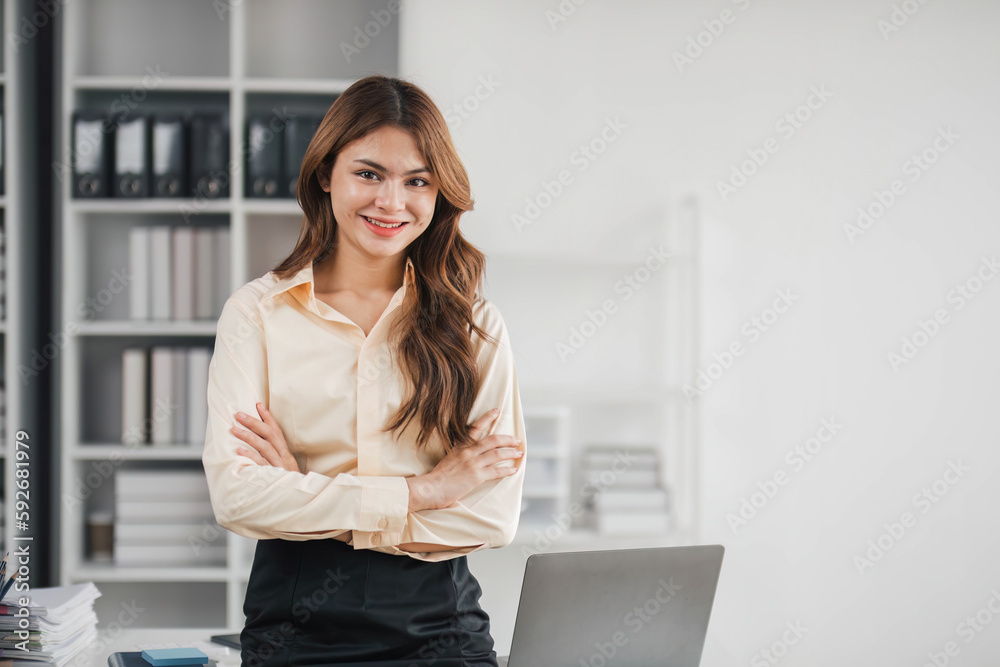 Business woman using calculator for do math finance on wooden desk in office and business working background, tax, accounting, statistics and analytic research concept.. Business woman using calculator for do math finance on wooden desk in office and business working background, tax, accounting, statistics and analytic research concept..