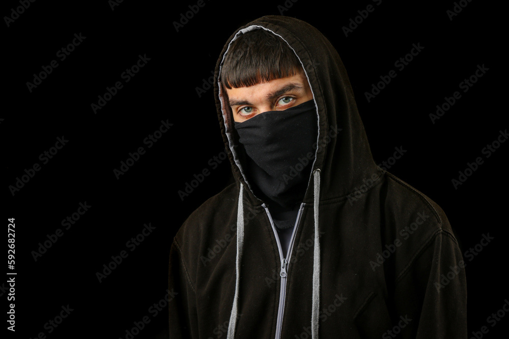 Teenage boy in a mask and hoodie Teenage boy in a mask and hoodie