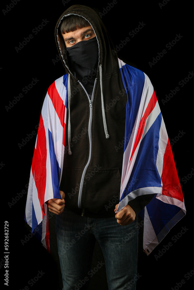 Teenage boy in a mask with a British Flag