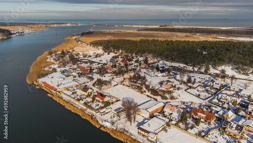 Górki Wschodnie district on Sobieszewo Island, Gdansk, Poland. View from the drone, winter, snowy climate.