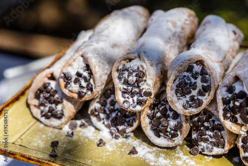 Close up of fancy cannoly pastries served at and outdoor buffet