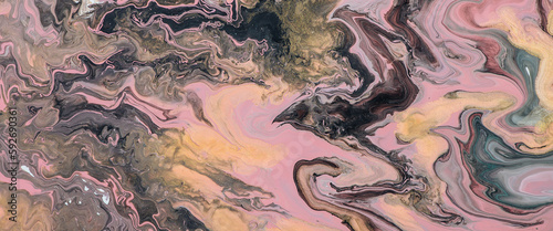 Fantasy fluid art background with mix of pink golden and black tints and random image of black raven. Dirty effect of acrylic paints. Liquid ink texture. Random abstract image of dragon, bat or crow.