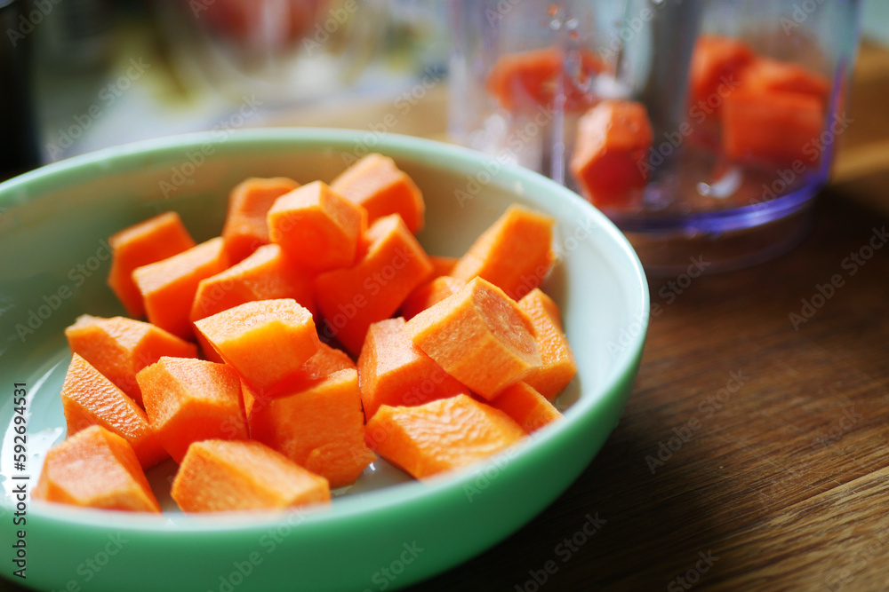 Carrot minced in blender. Cooking at home Carrot minced in blender. Cooking at home