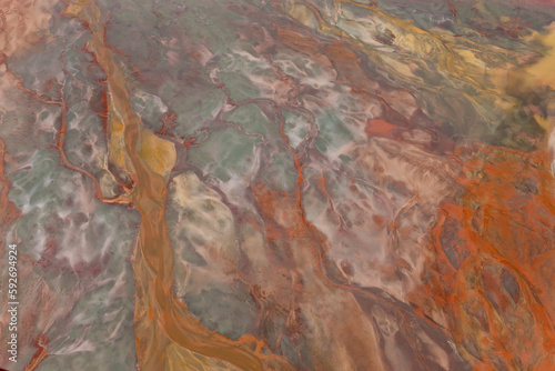 Aerial shot of oxidized iron minerals in water in old mining area, Río Tinto. Huelva Province, Spain
