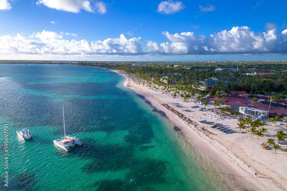 Fototapeta premium Dominican Republic Punta Cana, beautiful Caribbean sea coast with turquoise water and palm trees