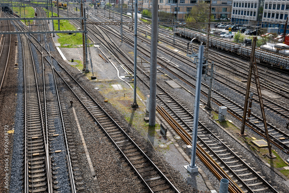 Several empty parallel train tracks in major rail hub in European city. Above view, trains, no people Several empty parallel train tracks in major rail hub in European city. Above view, trains, no people