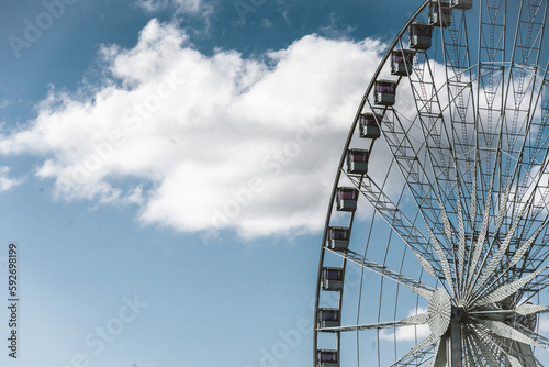 ferris wheel on a blue sky in a park