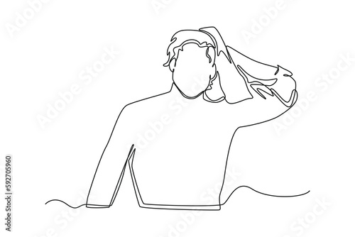 Single one line drawing man drying his hair with towel . Bathroom activities concept. Continuous line draw design graphic vector illustration.