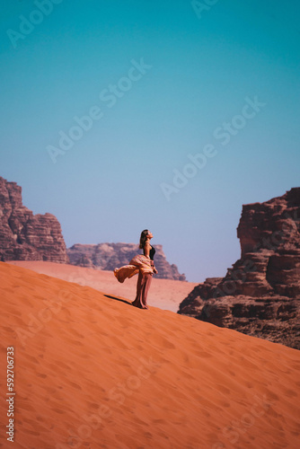 Young Woman Posing In The Wadi Rum Desert, Jordan