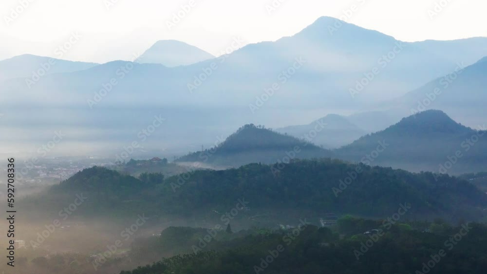 Cloud gap light (Crepuscular Ray) shining on the village. Capture the sunrise and sea of clouds here. Jinlong Mountain, Nantou, Taiwan