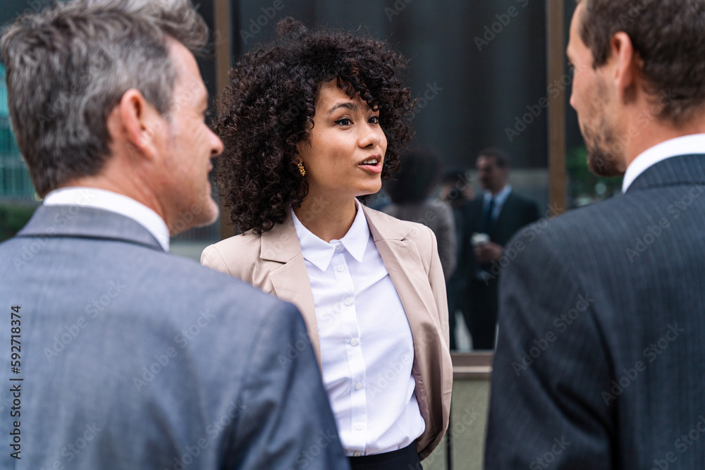 Multiethnic business people meeting in a business park - Multiracial group of corporate colleagues Multiethnic business people meeting in a business park - Multiracial group of corporate colleagues