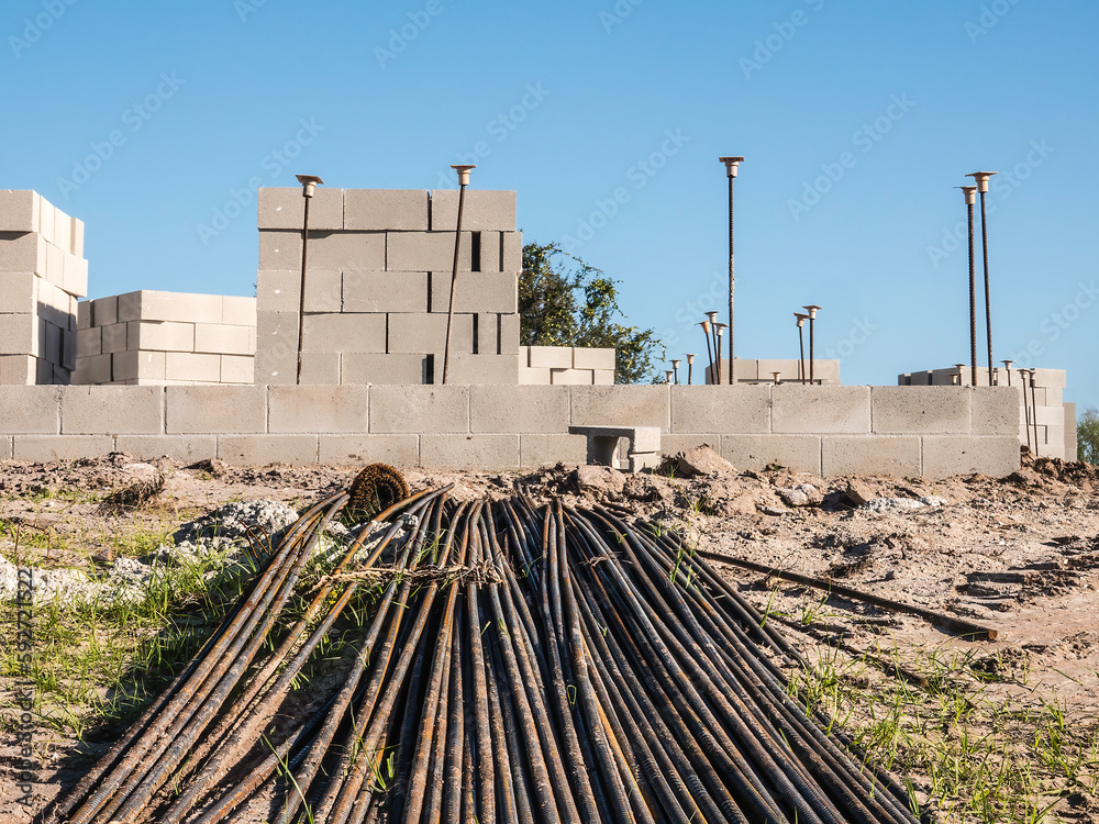 Many long reinforcing bars (rebar) for concrete masonry on construction