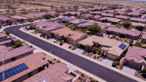 Aerial view of Goodyear, Arizona city with clean asphalt roads, low buildings and green trees