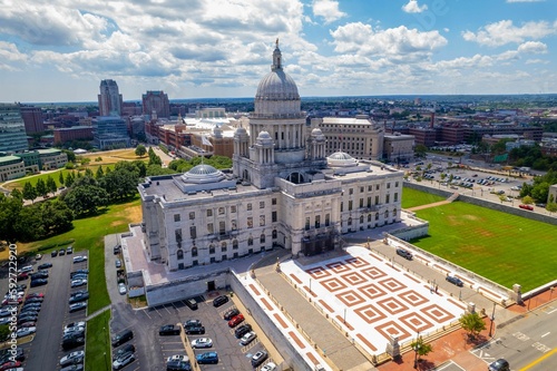 Aerial view of Rhode Island State House and Providence cityscape under blue cloudy sky