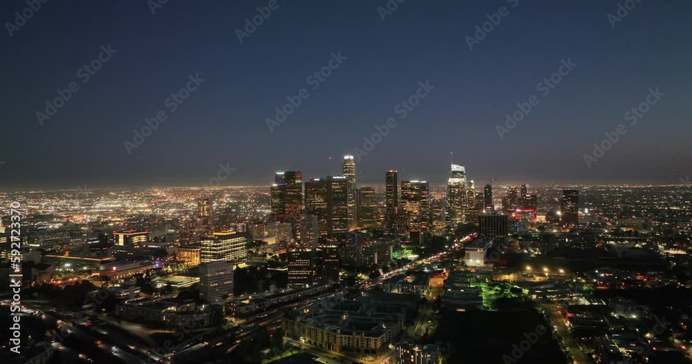 Illuminated streets downtown Los Angeles skyline at twilight dusk night. Aerial view. Los Angeles at Dusk. Aerial view of Los Angeles downtown city night skyline. LA valley California cityscape night Illuminated streets downtown Los Angeles skyline at twilight dusk night. Aerial view. Los Angeles at Dusk. Aerial view of Los Angeles downtown city night skyline. LA valley California cityscape night