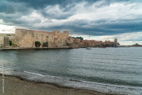 Collioure, Occitania France - June 8, 2022: Waterfront of the old city with the Church of Our Lady of the Angels