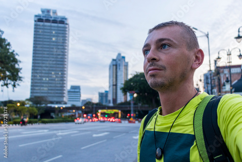 Photography Tourist takes Selfie with city buildings skyscrapers Kuala Lumpur Malaysia