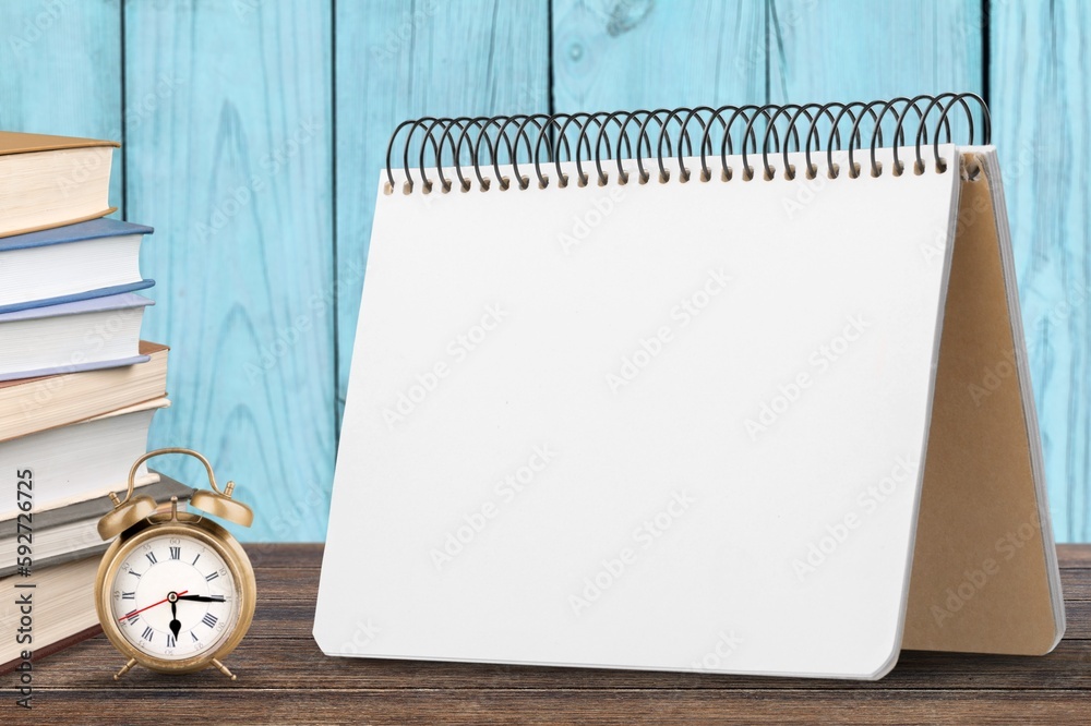 Blank desk calendar to plan year with retro alarm clock Blank desk calendar to plan year with retro alarm clock