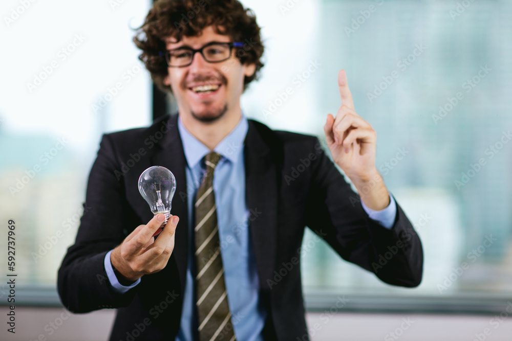 Businessman holding light bulb. Idea concept with innovation and inspiration. businessman holding illuminated light bulb. Brain creative thinking ideas and innovation concept. Businessman holding light bulb. Idea concept with innovation and inspiration. businessman holding illuminated light bulb. Brain creative thinking ideas and innovation concept.