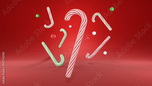Very festive and eye-catching Christmas background with red, white and green striped sweet Christmas candy canes floating in the air