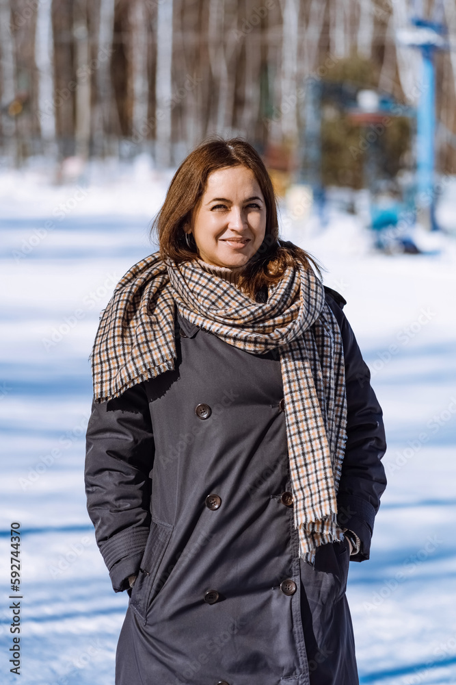 Smiling woman in full growth. Girl in winter. vertical 