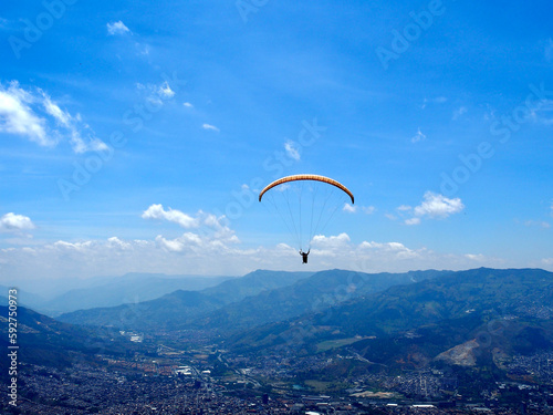 Medellin, Colombia - 20.05.2015: Parafoil of a paraglider flying above Medellin