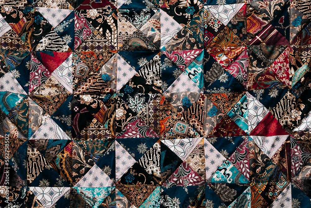 The background of the multicolored bedspread. Abstract Authentic Easthern Patterns and Backgrounds The background of the multicolored bedspread. Abstract Authentic Easthern Patterns and Backgrounds