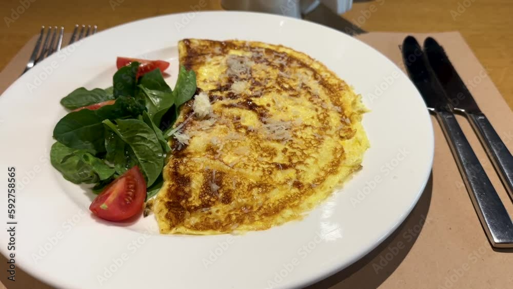 Omelet with cheese, cherry tomatoes and spinach. Healthy sports breakfast Omelet with cheese, cherry tomatoes and spinach. Healthy sports breakfast