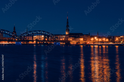 view of Old Riga across the Daugava river in the evening © Михаил Шорохов