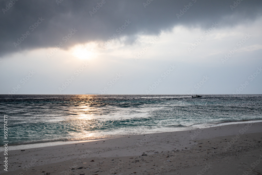 beautiful exotic tropical beach and stormy clouds