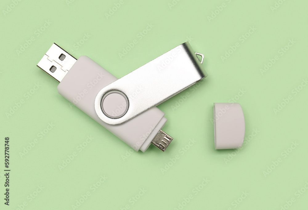 White USB flash drive on green background White USB flash drive on green background