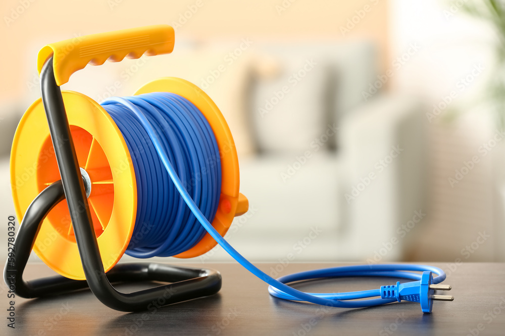 Extension electric cable reel in room Stock Photo