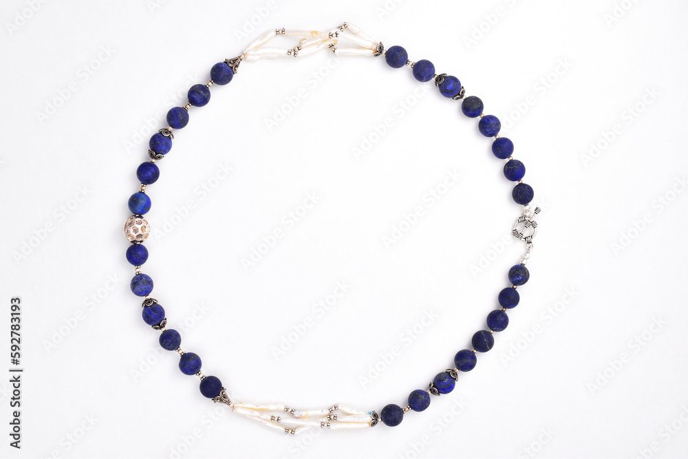 Obraz premium Semi precious blue beads necklace isolated on white background