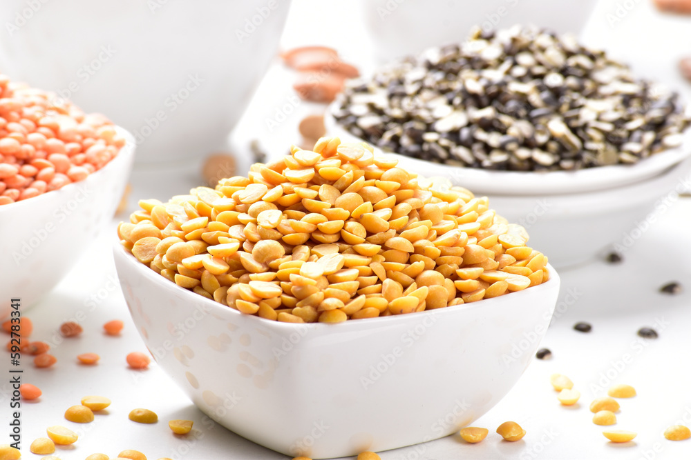 Close Up of uncooked chana dal in bowl on white background Close Up of uncooked chana dal in bowl on white background