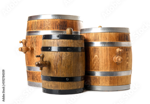 Oak barrels with metal hoops isolated on white background © Pixel-Shot