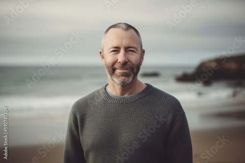Portrait of a handsome middle-aged man on the beach. © Robert MEYNER