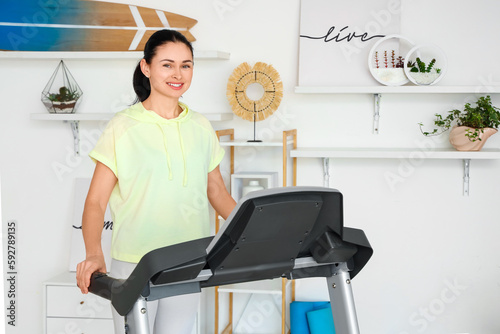 Beautiful woman training on...