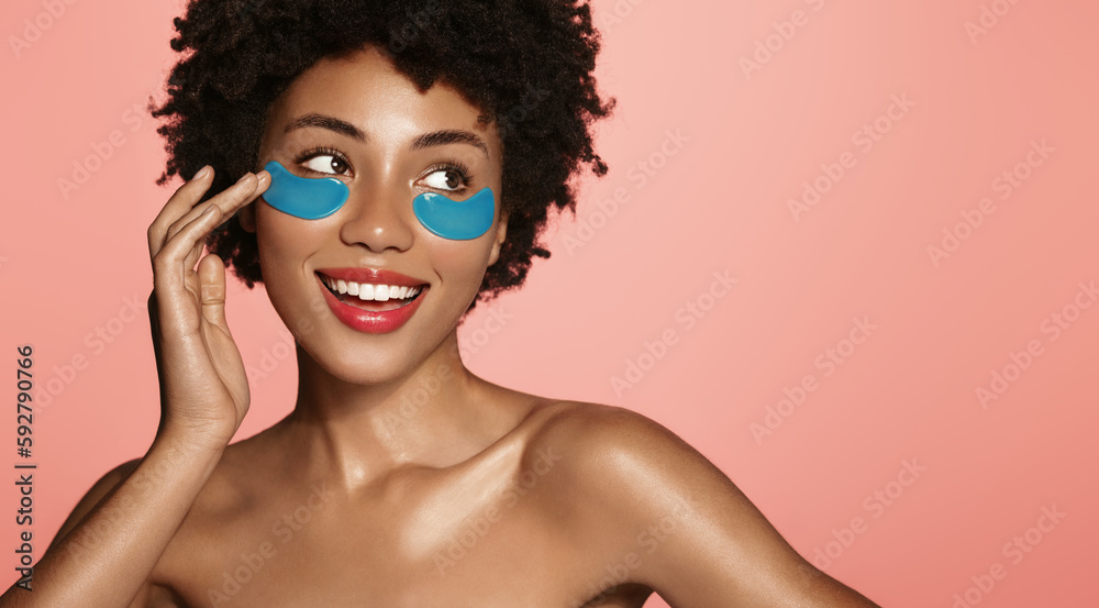Eye patches cosmetology. woman applies skincare product on her face to get rid of puffiness and dark circles, has spa day at home, does skin care routine, washes her face and applies toners and serums